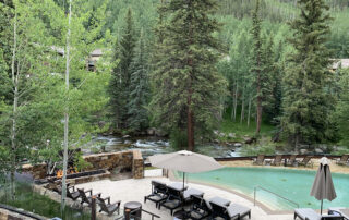 Grand Hyatt Vail in Summer - View from Gessner Bar over Pool and Gore Creek
