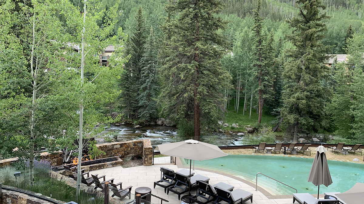 Grand Hyatt Vail in Summer - View from Gessner Bar over Pool and Gore Creek